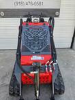 Vorx NL360 operator end: dual joystick controls, engine cover grille and auxiliary hydraulic couplers