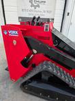 VORX NL750 mini skid steer, loader arm raised, VORX decal and serial number plate visible