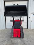 VORX NL750 mini skid steer, loader arm raised fully with the bucket tipped forward overhead