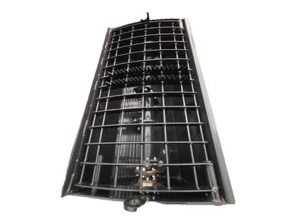 Black concrete mixing bucket seen from above, steel grate over the mixing drum, white background