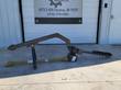 Wolverine post hole auger fully assembled: black A-frame hitch boom, gearbox, olive PTO driveline and 6-inch helical bit