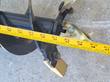 Auger bit tip: black flighting, gold-plated cutting teeth and bolt-on pilot point, tape measure alongside