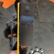 Tape measure along a blade bracket bolted to the cutter underside, reading about 9 inches