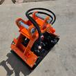 Wolverine E-VPC06 plate compactor, orange excavator pin-on bracket, sleeved hoses and black steel baseplate