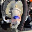 Hydraulic drive motor of the Wolverine E-VPC06 compactor, braided hose sleeves with hose clamp