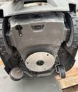 Underside of a robotic mower: housing, power switch, blade disc plate, drive wheels and caster