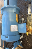 Baldor Reliance industrial motor in blue with warning label, wiring diagram and terminal box