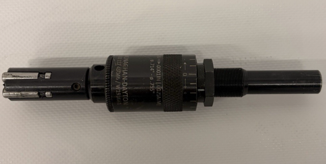 Monaghan-Dayton expanding reamer lying flat, with scale collar and slotted blade end, 0.714 to 0.755 inch