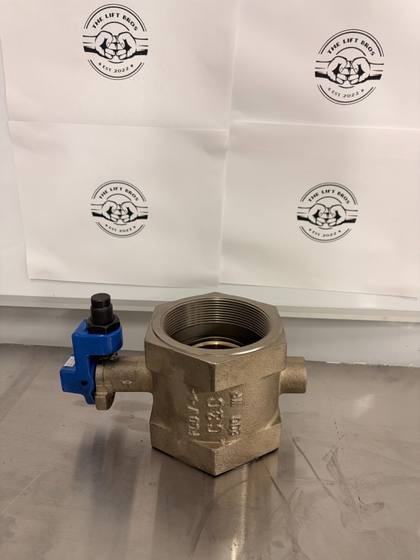 Bronze-colored threaded butterfly valve, side with cast flow arrow and C&C mark, blue stop bracket at left