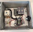 Inside an Eaton Cutler-Hammer motor starter enclosure: contactor, ABB fuse holders, terminal blocks and relay
