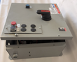 Eaton Cutler-Hammer 460-volt motor control enclosure with lid propped open, red disconnect handle and start/stop buttons