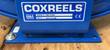 Coxreels nameplate on blue reel base, model TMPL-N-650, Made in USA, CE mark