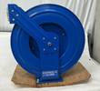 Blue Coxreels hose reel, front view with Coxreels label on the base and angled guide arm