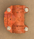 Red four-bolt tee-style grooved coupling with side outlet, cast P20 marking