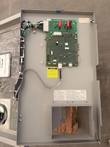 Open charger door showing the control circuit board, wiring harness and error code label