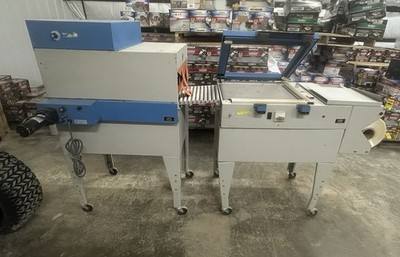 Blue and gray APS shrink wrap system: L-bar sealer with lid raised beside a heat tunnel, both on casters