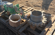 Green hydraulic actuator on a stainless bellows gate valve, plus a wrapped spare bellows, on a wood pallet