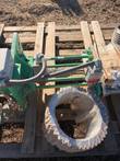 Namco Snap-Lock limit switch and conduit on the green valve frame, beside a plastic-wrapped bellows