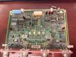 General Electric circuit board, component side with ICs, red indicator LEDs and a blue connector, top view
