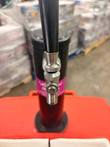 Front of the black tap tower with chrome faucet and handle