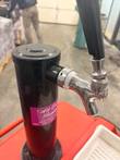 Black tap tower with chrome faucet and black handle on the red cart