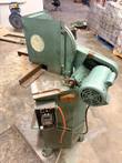 Green double miter saw seen from above, Pistorius guard, contactor box and orange cord on the base