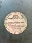 Round Pistorius Machine Co. caution and tooling sticker on the saw guard