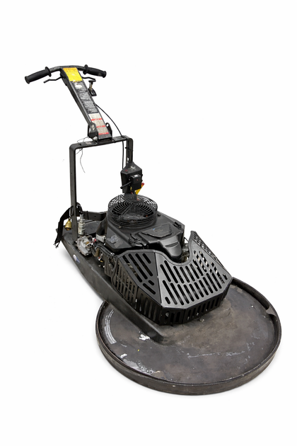 Black fan guard on a propane floor buffer engine