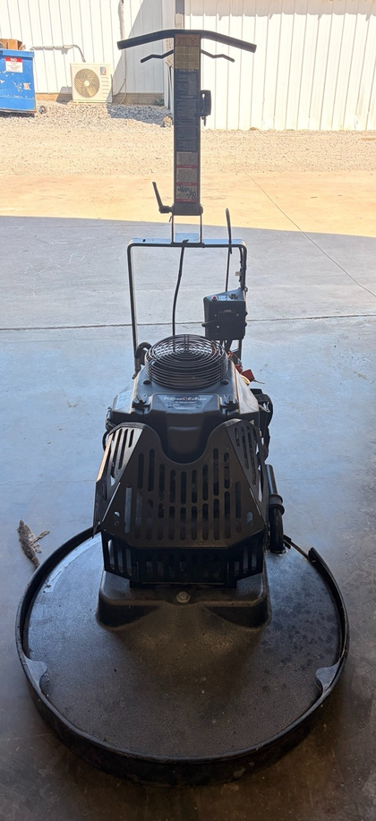 Propane floor burnisher with upright handle, engine shroud and round pad guard
