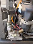 Propane regulator, safety valve and fuel hose beside the engine