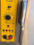 Yellow steamer control panel with thermostat dial, indicator lights and ON/OFF buttons