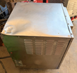 AccuTemp steamer from the side, louvered side panel and a dented top corner