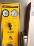 Steam 'N' Hold control panel with vacuum and temperature gauges and a 0 to 90 minute timer dial