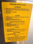 Yellow operating instructions label on the steamer