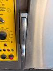 Steam 'N' Hold steamer door handle beside the yellow control panel with thermostat and indicator lights