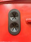 Black rubber hose-port grommet on the breaker housing