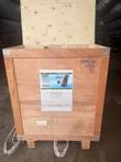 Wooden shipping crate with a 400 concrete grinder model XK400 spec label and USA shipping label