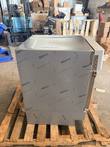 Stainless undercounter refrigerator on a wood pallet, side panel still covered in protective film