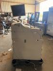 Cash recycler cabinet with monitor on an arm and a white cord, on a black plastic base