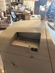 Recessed slot with a small connector on the curved top panel of the cash recycler
