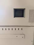 Square cutout, perforated vent and slotted panel on the cash recycler cabinet