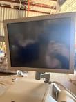 Flat-panel monitor, screen off, on a swivel arm above the cash recycler's top cover