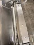Serrated and grooved stainless steel rollers with bolted guard bar on a meat tenderizer