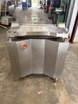 Front of a stainless steel meat tenderizer on casters with a red emergency stop and SK3 marking