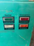 Normal and Emergency connected and available indicator lights on the teal transfer switch door
