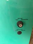 Keyed Normal, Test, Retransfer selector switch and Auto/Manual retransfer button on the teal enclosure