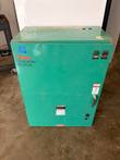 Teal Cummins Onan automatic transfer switch enclosure, front view with indicator lights, handle and data plate