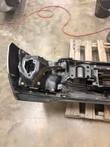 Back of the bumper's left end showing steel mounting brackets