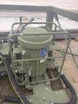 Green filter separator tank inside a steel guard frame on the fuel transfer skid