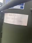 Warning plate reading Max Working Pressure 100 PSI on the green filter tank